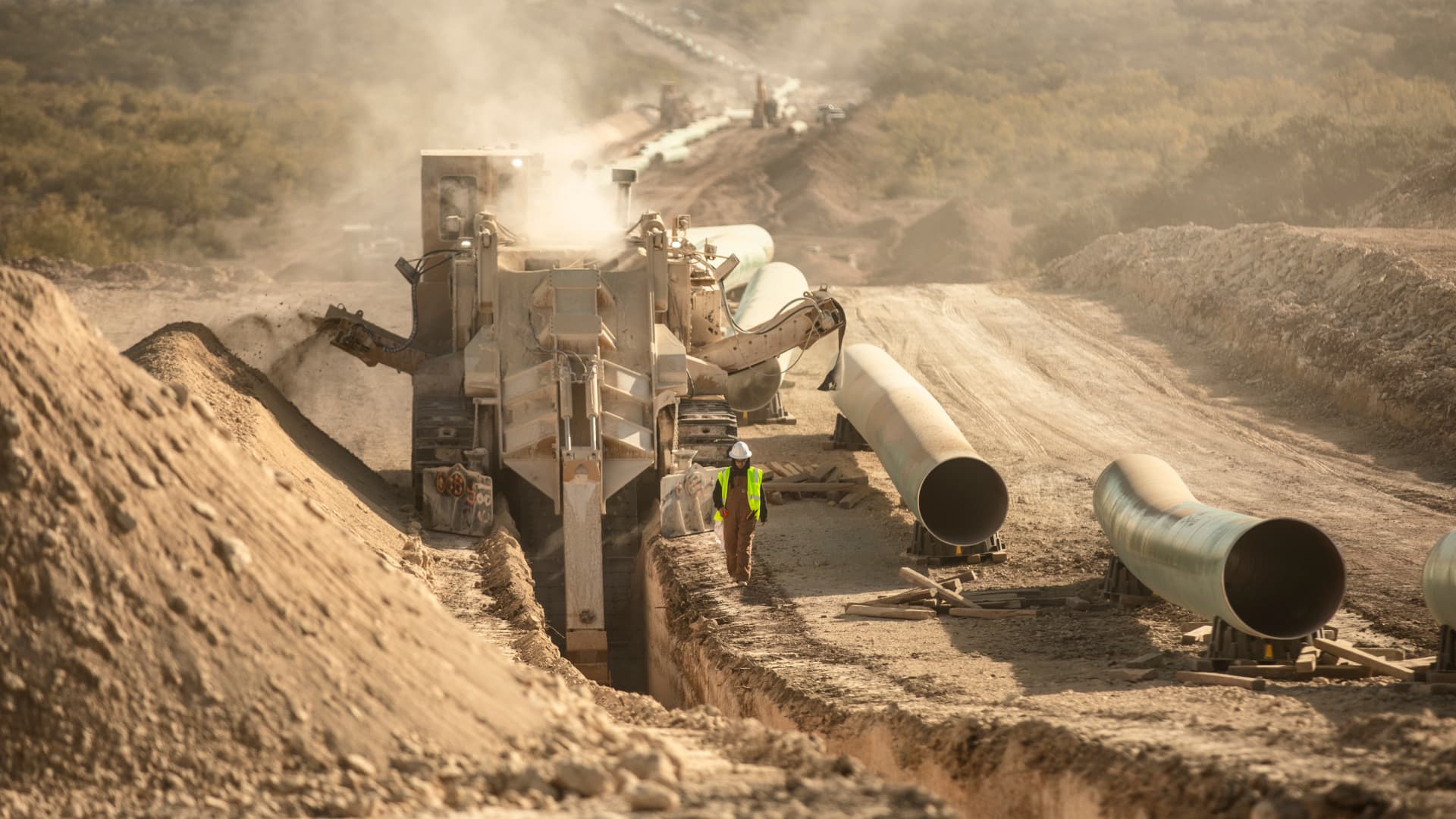 Machine digging a ditch to run piplines.